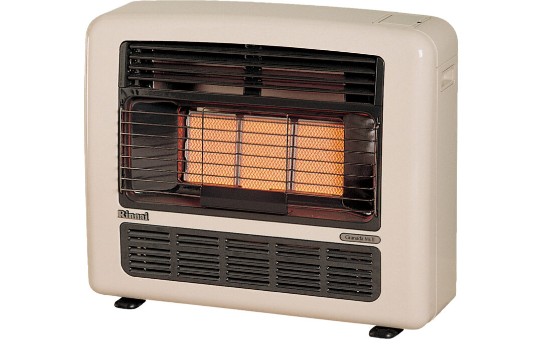 A beige gas heater with a black grate and visible orange glow, indicating it's turned on. The design includes vents at the bottom and control buttons on the side. The heater is freestanding on a white background.