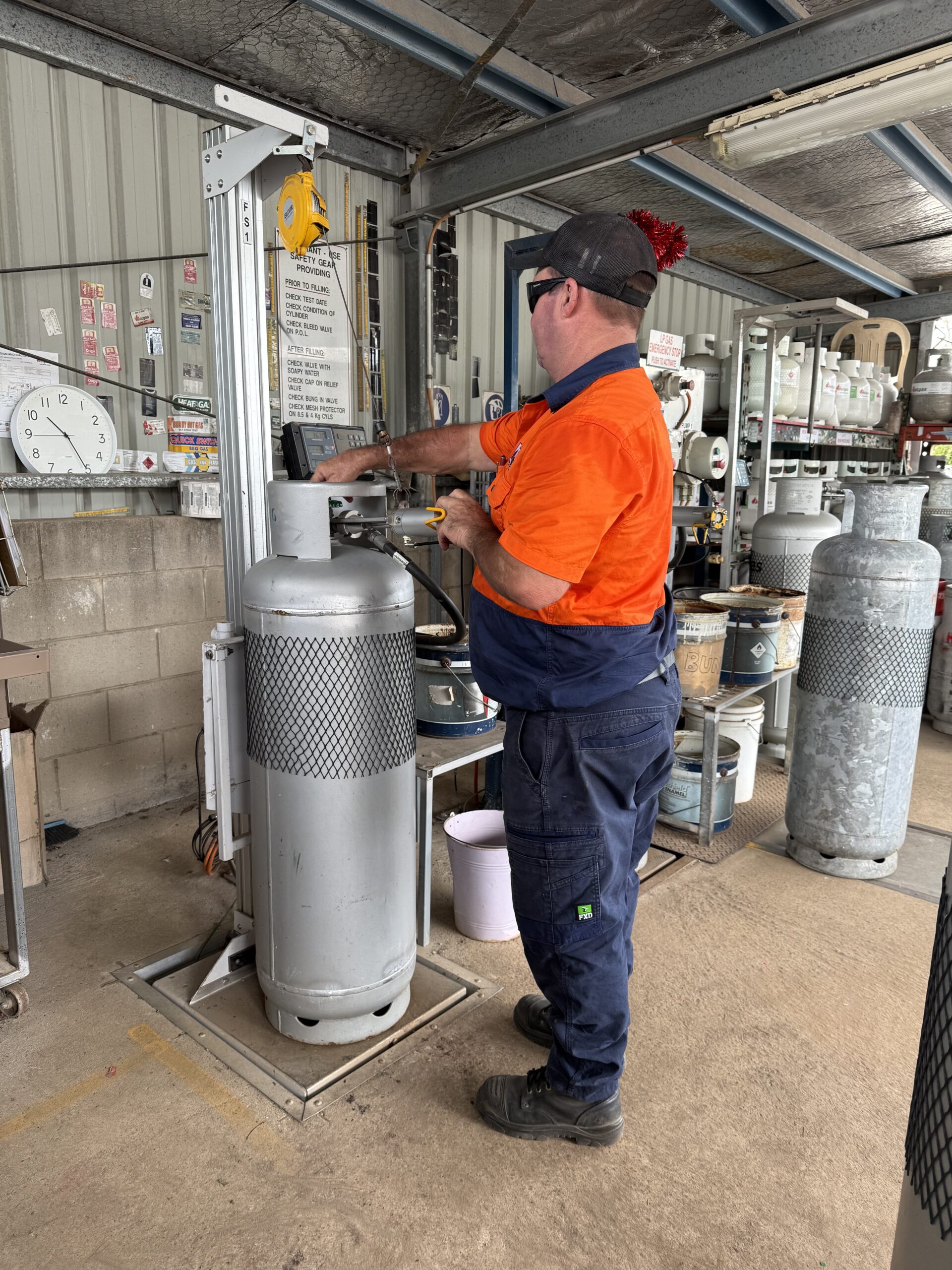 Img 3927 Team member filling LPG cylinder at digital scales